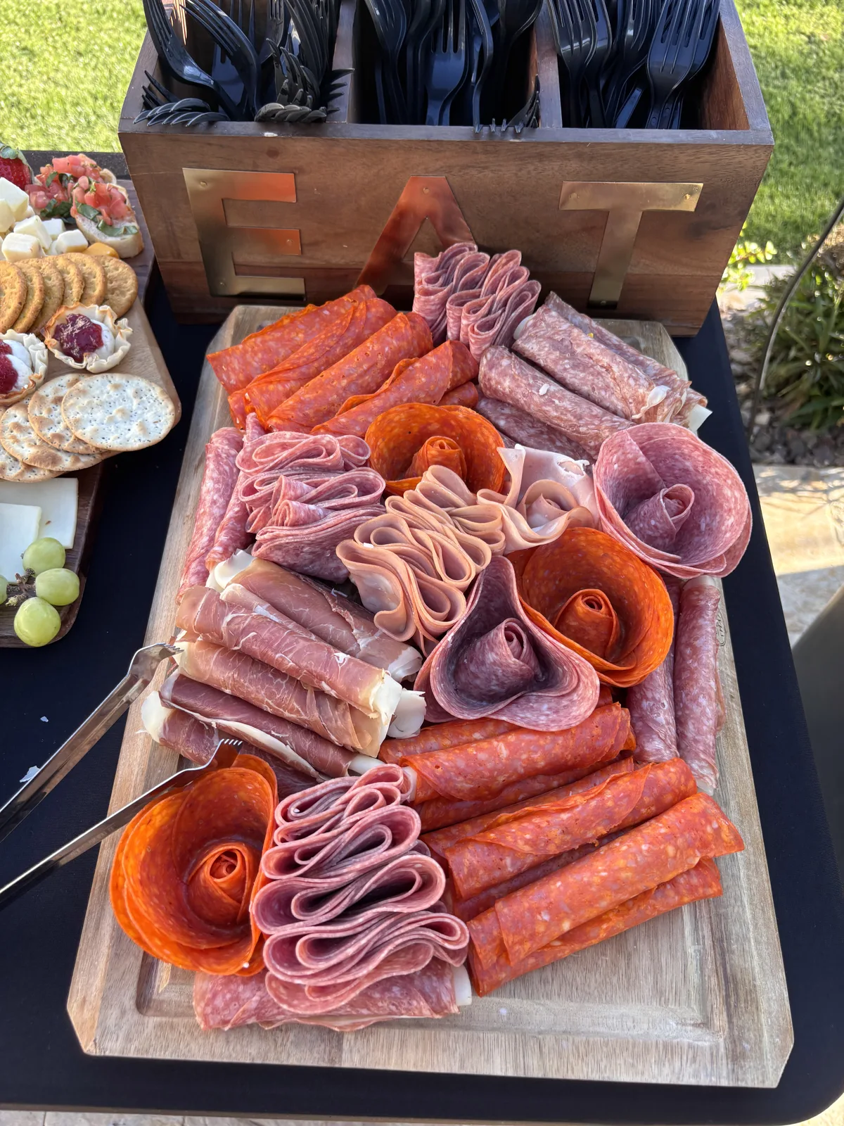 Colorful charcuterie arrangement with fresh fruits and specialty cheeses
